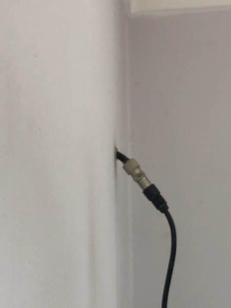 Tv cables poking out of wall