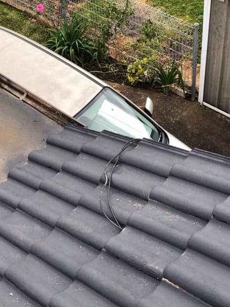 Tv antenna cables coming out of roof tiles